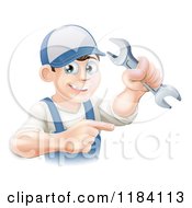 Cartoon Of A Happy Worker Man Holding A Wrench And Pointing Royalty Free Vector Clipart