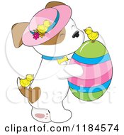 Poster, Art Print Of Cute Puppy Wearing A Sun Hat And Carrying An Easter Egg With Chicks
