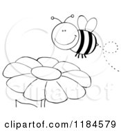 Cartoon Of A Happy Black And White Bee Over A Flower Royalty Free Vector Clipart