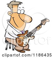 Happy Man Playing A Guitar On A Stool