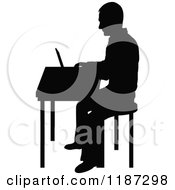 Poster, Art Print Of Black Silhouetted Man Working On A Laptop At A Desk