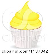 Clipart Of A Cupcake With Yellow Frosting And A White Wrapper Royalty Free Vector Illustration
