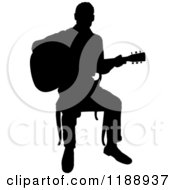 Poster, Art Print Of Black Silhouetted Man Playing A Guitar In A Chair