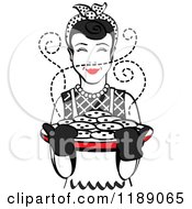 Poster, Art Print Of Retro Happy Black Haired Housewife Holding Freshly Baked Cookies