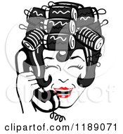 Happy Retro Black Haired Housewife With Her Hair Up In Curlers Laughing While Talking On A Landline Telephone