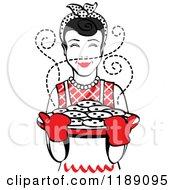 Poster, Art Print Of Retro Happy Black Haired Housewife Holding Freshly Baked Cookies 2