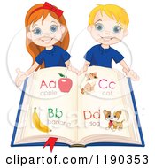 Happy School Children Holding An Alphabet Book