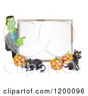 Happy Frankenstein With Cats And Halloween Pumpkins Around A White Sign