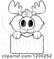 Poster, Art Print Of Black And White Cute Moose Calf Over A Sign