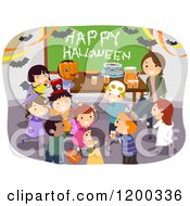 Female Teacher And Happy Diverse School Children Having A Classroom Halloween Party