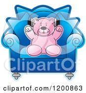 Pink Teddy Bear Wearing Headphones In A Blue Chair