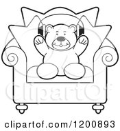 Poster, Art Print Of Black And White Teddy Bear Wearing Headphones On A Chair