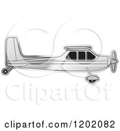 Clipart Of A Small Silver Light Airplane Royalty Free Vector Illustration