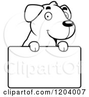 Poster, Art Print Of Black And White Cute Labrador Puppy Over A Sign