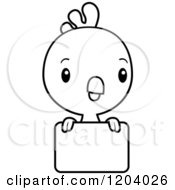 Cartoon Of A Black And White Cute Baby Rooster Over A Sign Royalty Free Vector Clipart