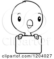Cartoon Of A Black And White Cute Baby Parrot Over A Sign Royalty Free Vector Clipart