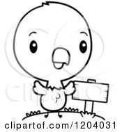Cartoon Of A Black And White Cute Baby Bald Eagle By A Sign Post Royalty Free Vector Clipart