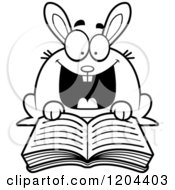 Cartoon Of A Black And White Excited Rabbit Reading A Book Royalty Free Vector Clipart