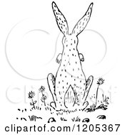 Clipart Of A Vintage Black And White Rear View Of A Rabbit Royalty Free Vector Illustration