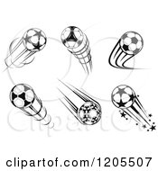 Clipart Of Black And White Flying Soccer Balls Royalty Free Vector Illustration