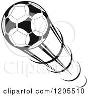 Clipart Of A Black And White Flying Soccer Ball 3 Royalty Free Vector Illustration
