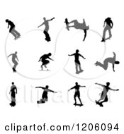 Clipart Of Black Silhouetted Skateboarders Royalty Free Vector Illustration