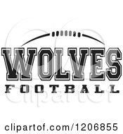 Clipart Of A Black And White American Football And WOLVES Football Team Text Royalty Free Vector Illustration