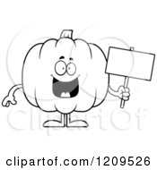 Cartoon Of A Black And White Happy Pumpkin Mascot Holding A Sign Royalty Free Vector Clipart