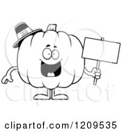 Cartoon Of A Black And White Happy Pilgrim Pumpkin Mascot Holding A Sign Royalty Free Vector Clipart