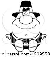 Cartoon Of A Black And White Happy Male Pilgrim Man Sitting Royalty Free Vector Clipart