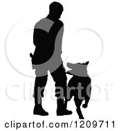 Clipart Of A Black Silhouetted Police Officer Training With His K9 Dog 2 Royalty Free Vector Illustration