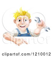 Cartoon Of A Happy Mechanic Man Holding A Wrench And Pointing Down To A Sign Royalty Free Vector Clipart