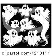 Cartoon Of White Halloween Ghosts On Black Royalty Free Vector Clipart