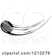Clipart Of A Black And White Flying Hockey Puck 2 Royalty Free Vector Illustration