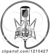 Clipart Of A Retro Silver Microphone And Wire Circle Royalty Free Vector Illustration by Lal Perera