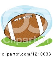 Cartoon Of A Brown American Football On Grass Royalty Free Vector Clipart