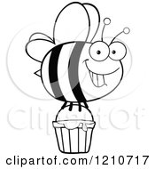 Cartoon Of A Black And White Happy Bee Flying With Honey Royalty Free Vector Clipart