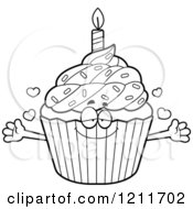 Cartoon Of A Black And White Loving Birthday Cupcake Mascot Wanting A Hug Royalty Free Vector Clipart by Cory Thoman