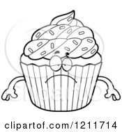 Cartoon Of A Black And White Depressed Sprinkled Cupcake Mascot Royalty Free Vector Clipart