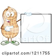 Cartoon Of A Happy Peanut Mascot Holding And Pointing To A Sign Royalty Free Vector Clipart