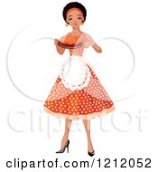 Pretty Black African American Woman An Apron And Polka Dot Dress Holding A Cake