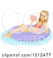 Poster, Art Print Of Happy Young Woman In A Bikini Reading A Book On An Inner Tube