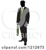 Poster, Art Print Of Silhouetted Businessman With A Green Tie And Briefcase