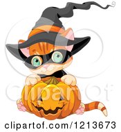 Cute Orange Halloween Kitten Wearing A Witch Hat And Hugging A Pumpkin