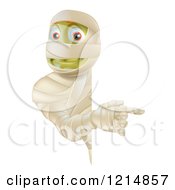 Poster, Art Print Of Happy Halloween Mummy Looking Around And Pointing To A Sign