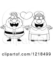 Clipart Of A Black And White Santa And Mrs Claus Couple Holding Hands Under A Heart Royalty Free Vector Illustration
