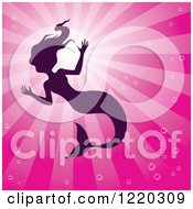 Poster, Art Print Of Silhouetted Swimming Mermaid Over Pink Rays