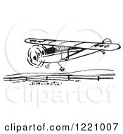 Clipart Of A Black And White Flying Airplane Royalty Free Vector Illustration by Picsburg