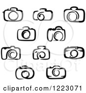 Clipart Of Black And White Cameras 2 Royalty Free Vector Illustration