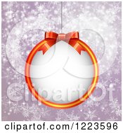 Clipart Of A Christmas Bauble Frame Over Purple With Snowflakes Royalty Free Vector Illustration